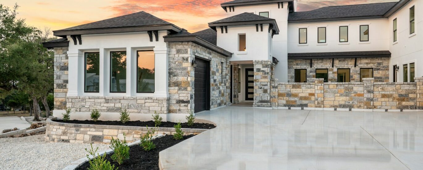 Modern luxury house with stone accents at sunset