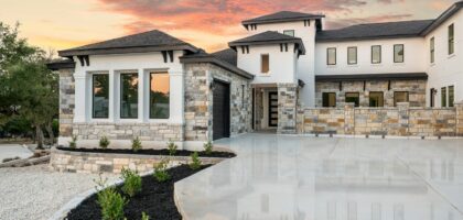 Modern luxury house with stone accents at sunset