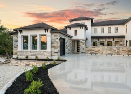 Modern luxury house with stone accents at sunset