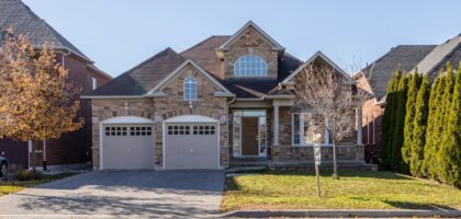brown and white concrete house under blue sky during daytime
