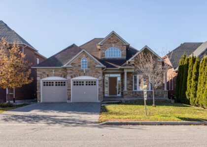 brown and white concrete house under blue sky during daytime